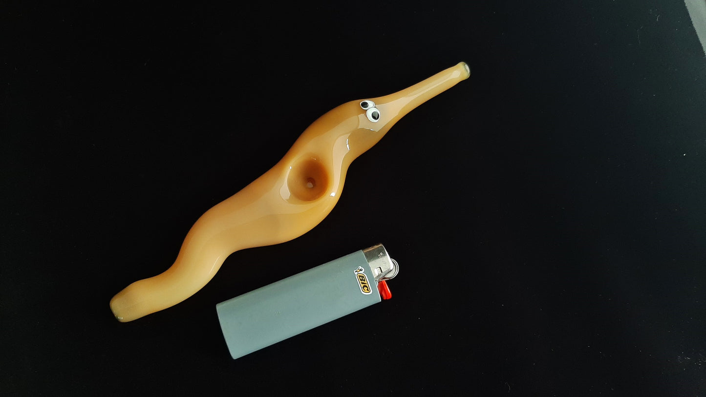 Hand blown glass worm on a string pipe. Unique gift idea.