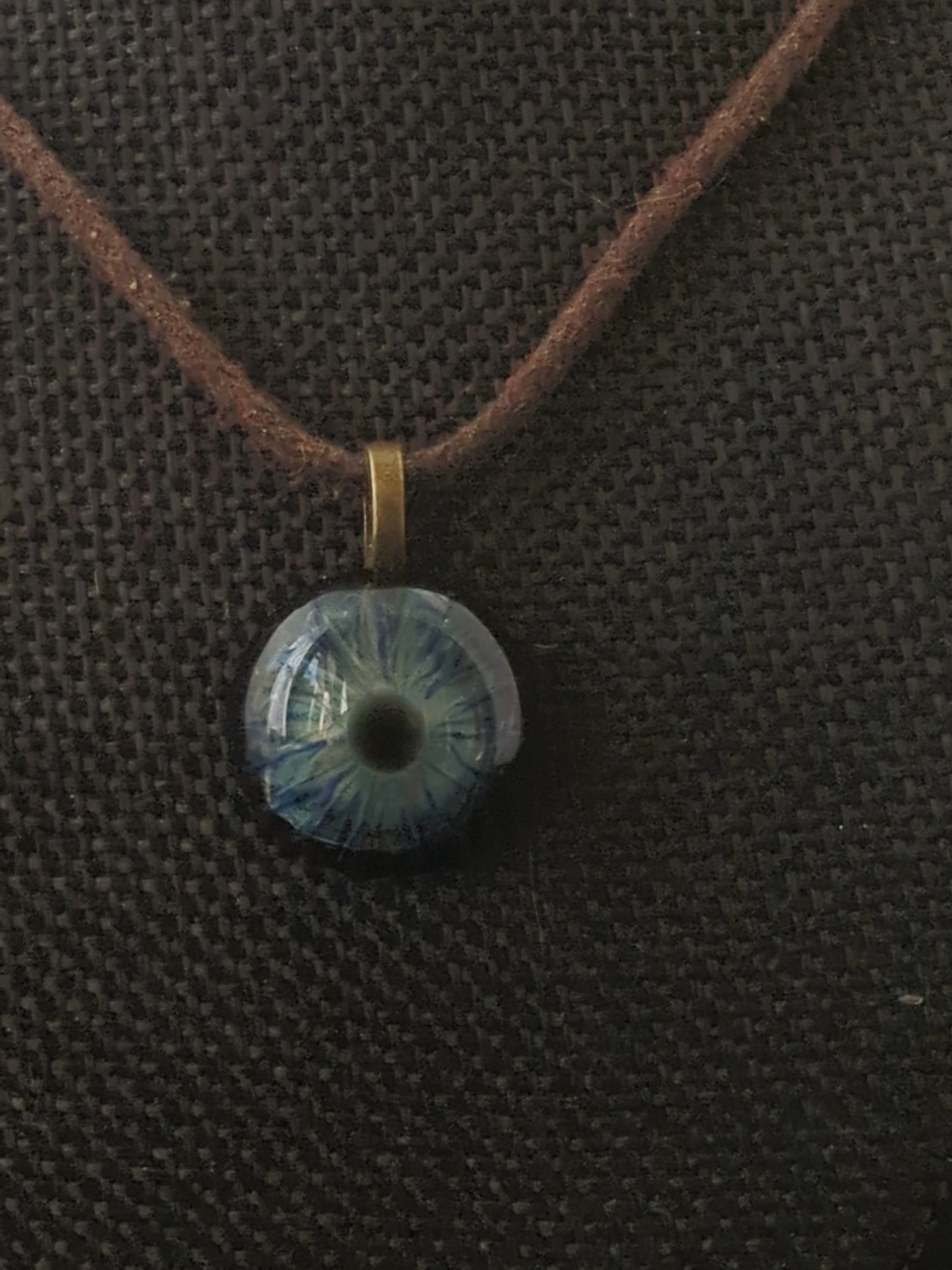 Detailed Glass Eye Pendant