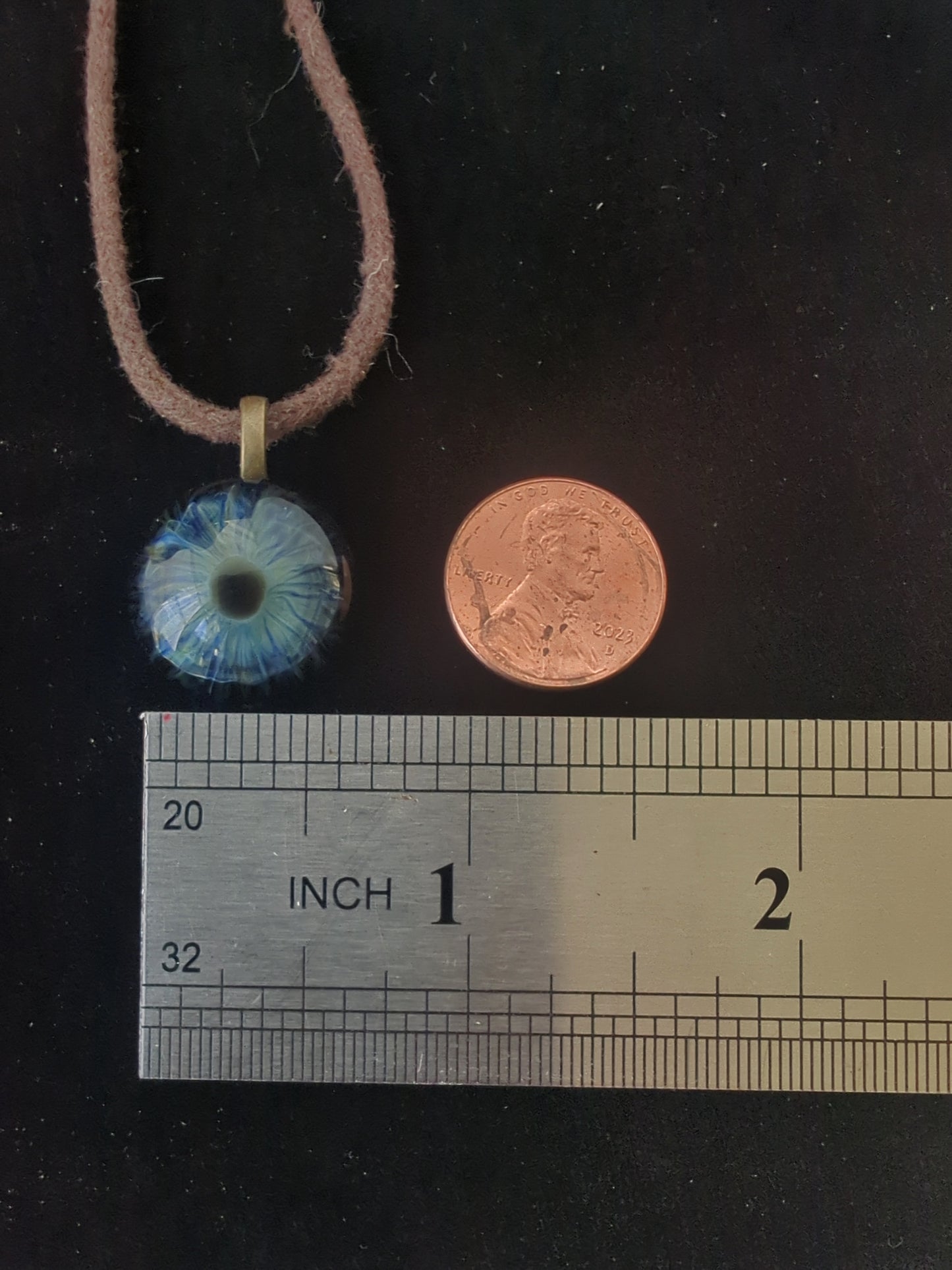 Detailed Glass Eye Pendant
