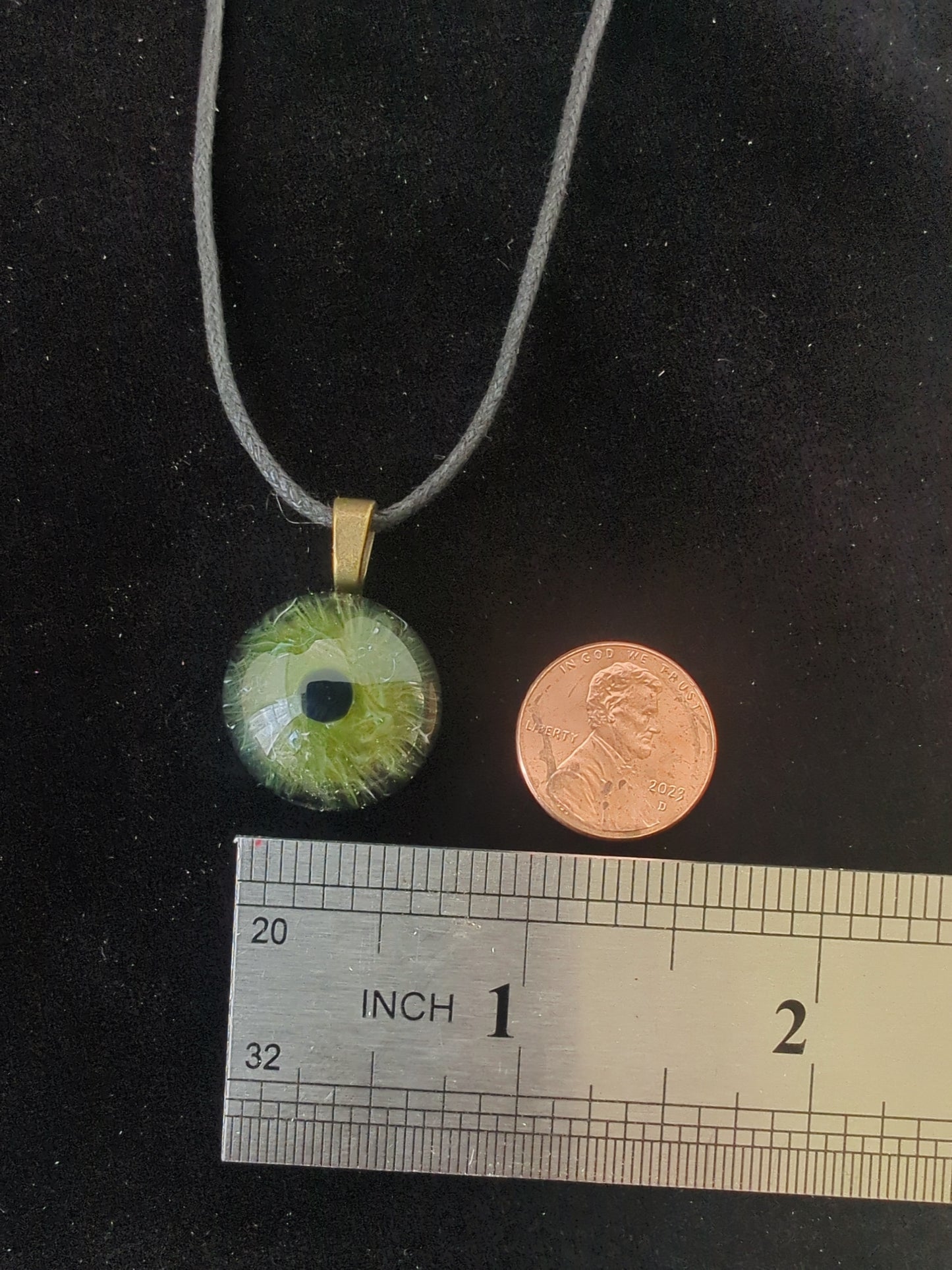 Detailed Glass Eye Pendant