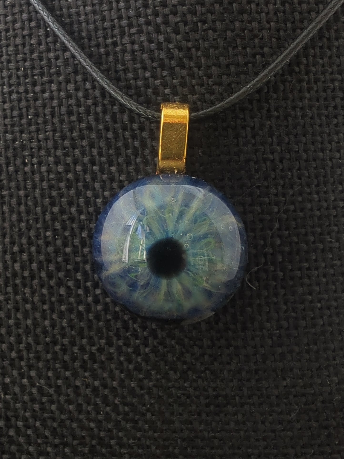 Detailed Glass Eye Pendant