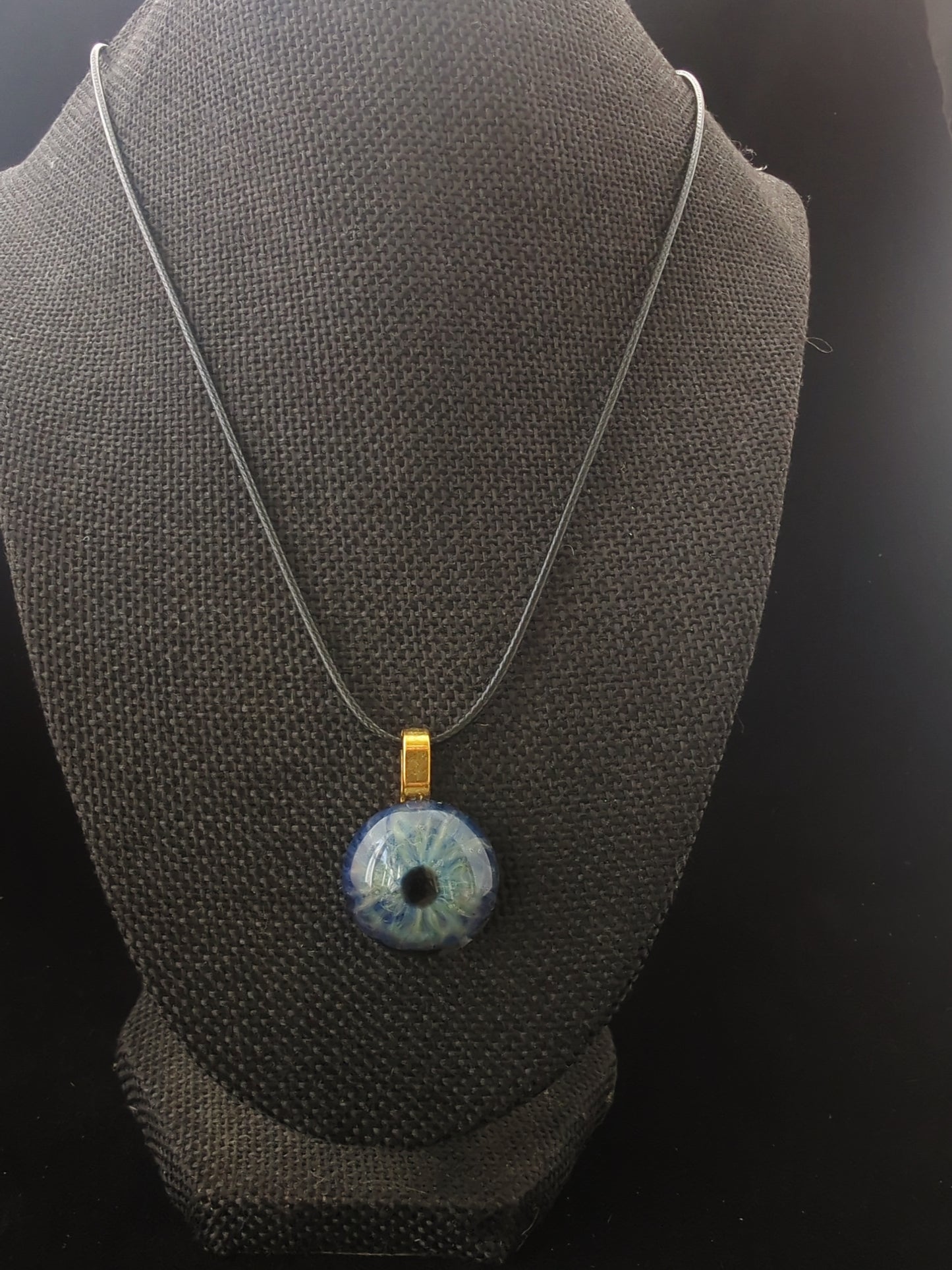 Detailed Glass Eye Pendant