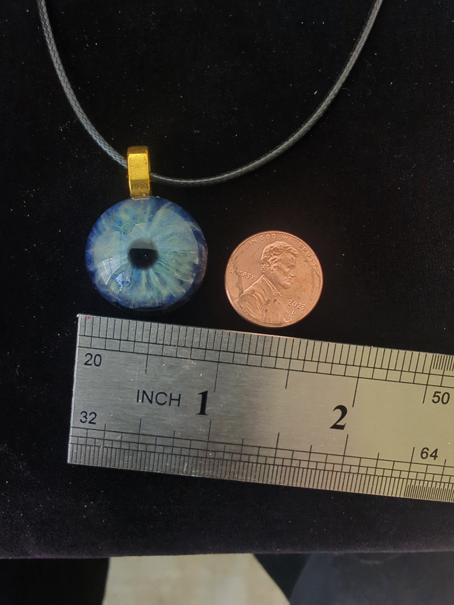 Detailed Glass Eye Pendant