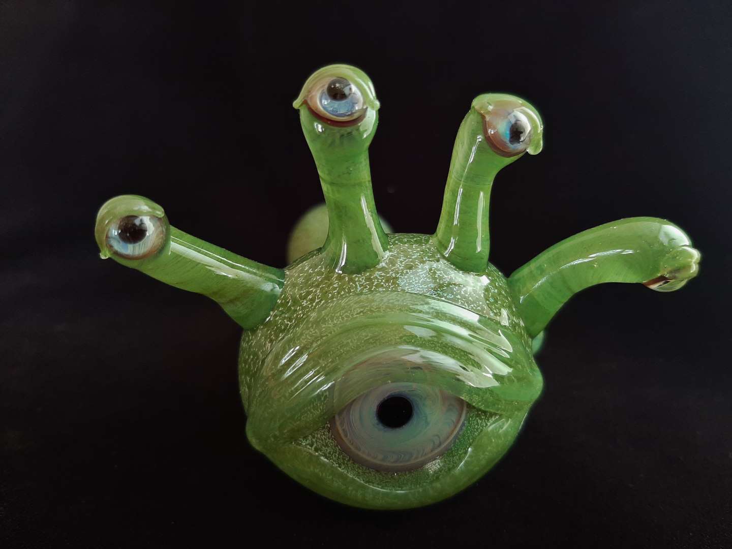 Glass beholder pipe. Five eyes and a spooky look.